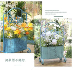 support fleurs métal vieilli pot suspendu signe garden gravures feuilles papillons fleurs blanches jaunes