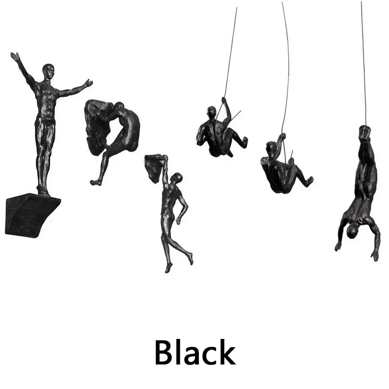 ornements statuettes grimpeurs noir sculptures détaillées art contemporain fixations chaînes socles décoration murale