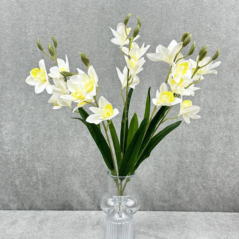 bouquet fleurs artificielles orchidées cymbidium roses blanches violettes jaunes décoration intérieure maison moderne minimaliste