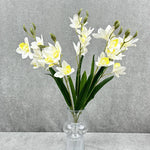 bouquet fleurs artificielles orchidées cymbidium roses blanches violettes jaunes décoration intérieure maison moderne minimaliste