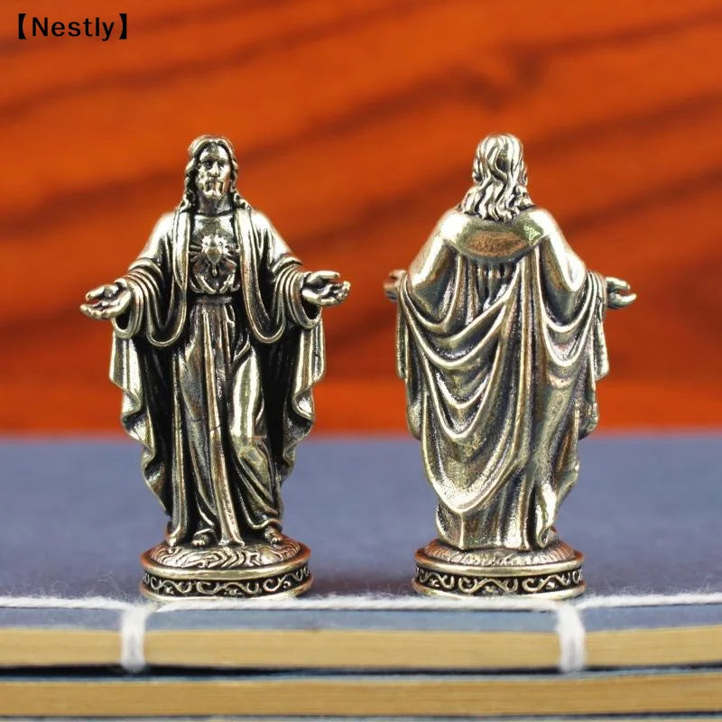 statuette religieuse argentée détail sculpté classique figure humaine vêtements larges base décorative