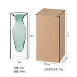 vase transparent goutte forme table arrangement floral rouge jaune vert pâle decoration intérieur