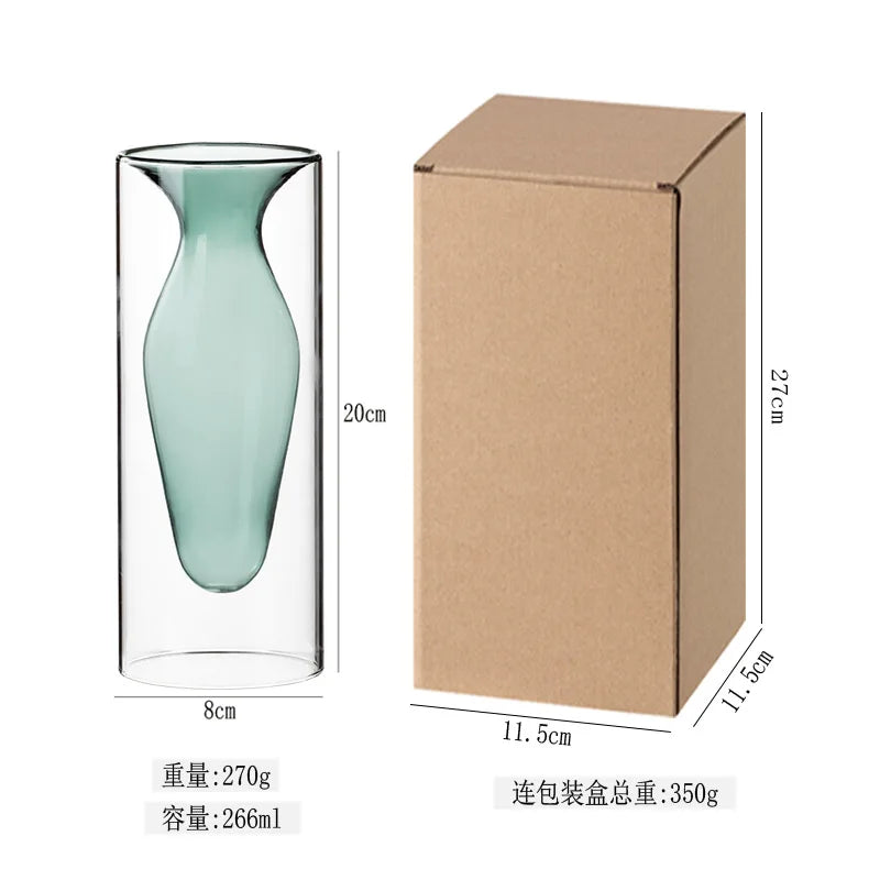 vase transparent goutte forme table arrangement floral rouge jaune vert pâle decoration intérieur
