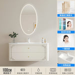 meuble salle bain noir blanc tiroirs vasque ornements dorés classique fixations murales accessoires cosmétiques