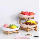 support fruits moderne bois blanc bambou compartimenté rose clair vert clips métalliques fruits variés