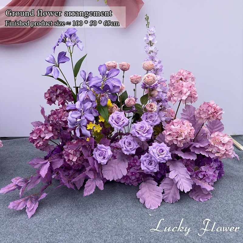 décoration événement extérieur mariage anniversaire roses fleurs variées feuillage dense tissu rouge romantique élégant