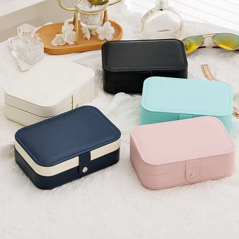 boîte bijoux moderne velours beige cuir bleu rose compartiments élégants portables voyage