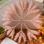 décoration noël plumes artificielles branches feuilles pin pommes coton rouges traditionnellements