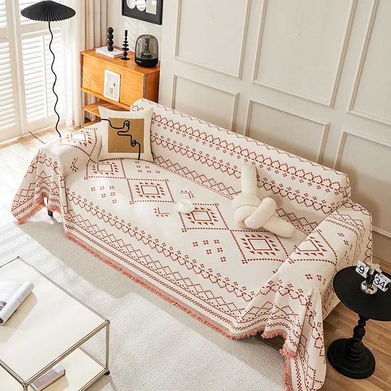 couverture canapé moderne beige noir motif géométrique franges oreiller décoratif ethnique