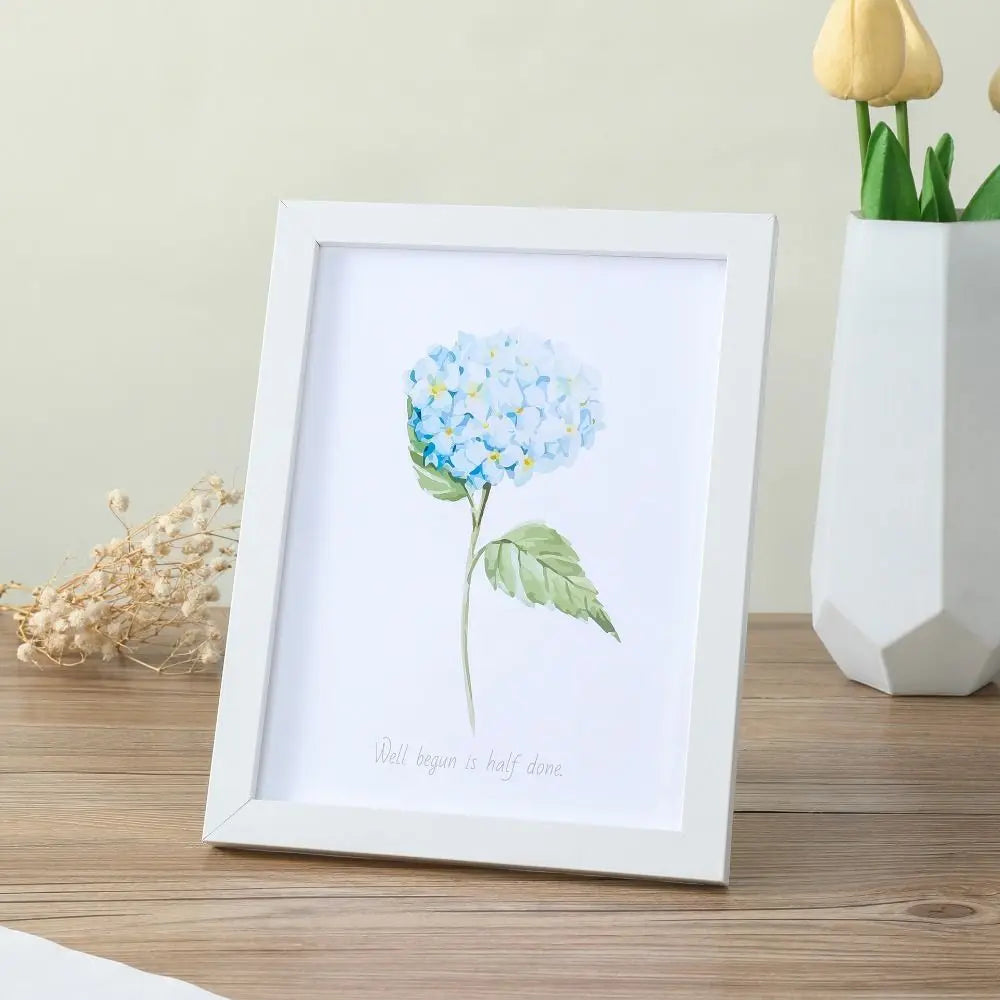 cadre photo bois moderne floral blanc noir cactus palmier fleurs bleues minimaliste mur table