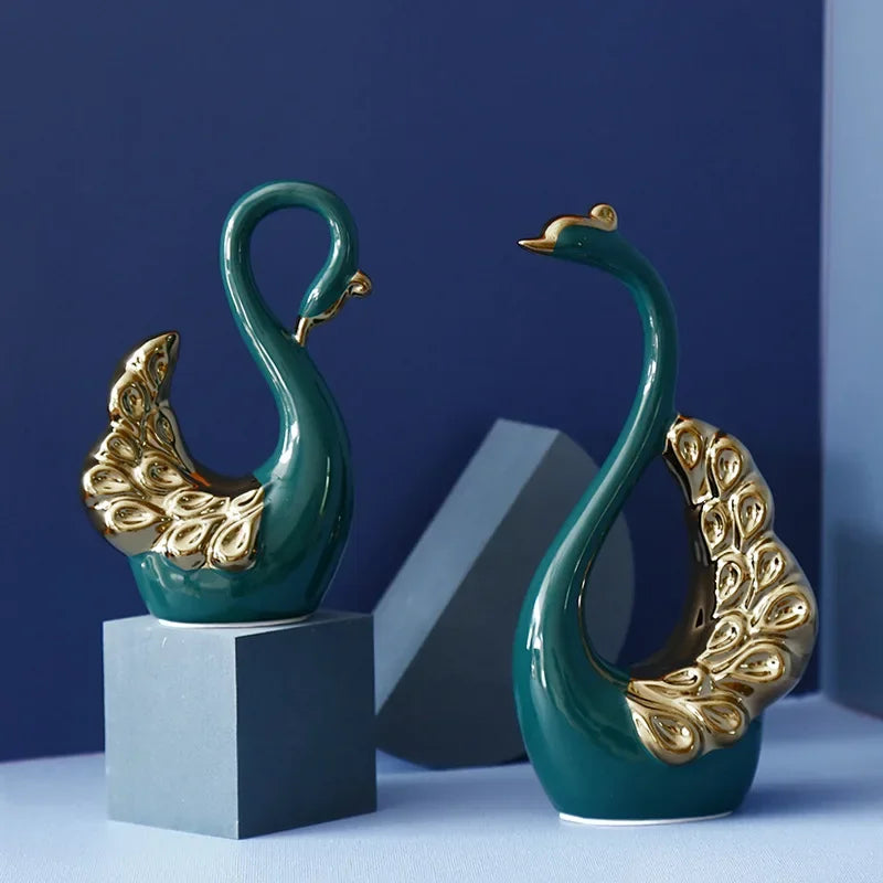 statues cygnes vert doré motif plumeux modernes élégantes décoration intérieure tableaux livres