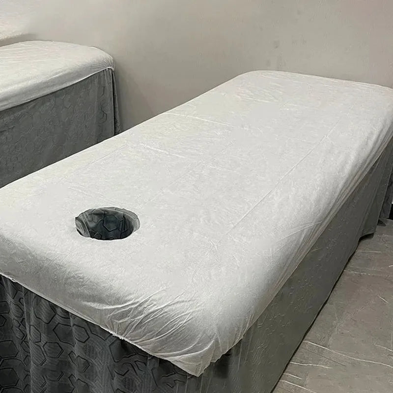 couverture table massage blanche tissu lisse hexagonal hygiène professionnel pliée relaxation salon beauté