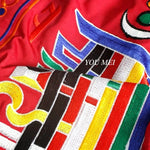 rideau tibétain brodé motifs géométriques tissu coloré jaune rouge vert bleu blanc orange
