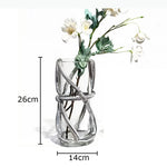vase moderne transparent tiges entrelacées orange sans fleur