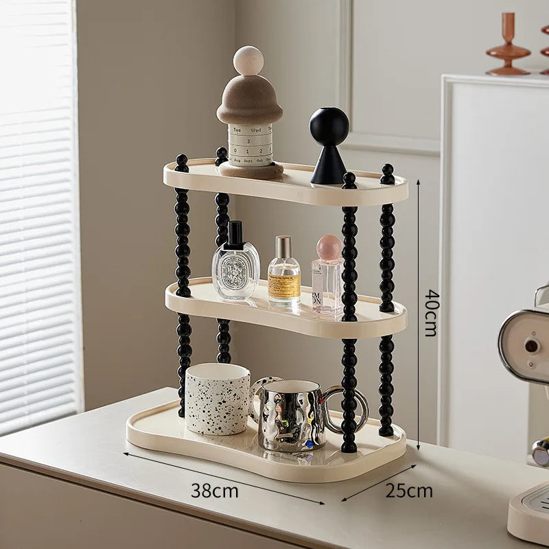 étagère trois niveaux moderne minimaliste blanc noir cosmétiques parfums tasses blancs