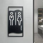 signalisation toilettes moderne symboles homme femme texte TOILET bois brun clair blanc tringle noire