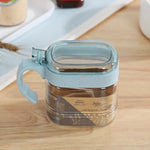 boîtes épices transparentes verre moderne rose verte bleu poignées couteau service herbes condiments cuisine