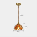 suspension lumineuse verre teinté art deco or marron bleu clair motifs géométriques opacité chaînes