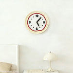 horloge murale moderne minimaliste rouge noir beige clair points texture ondulée fixée mur vintage