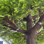 arbre artificiel vert feuilles fines tronc rugueux décoration extérieure réaliste anniversaire maison sol