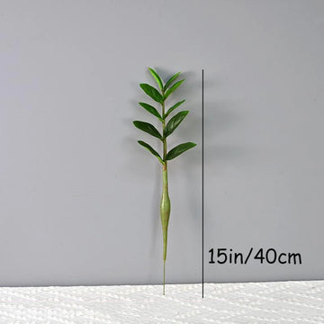 plantes artificielles branches vertes feuilles simples extérieur moderne pot blanc exposé