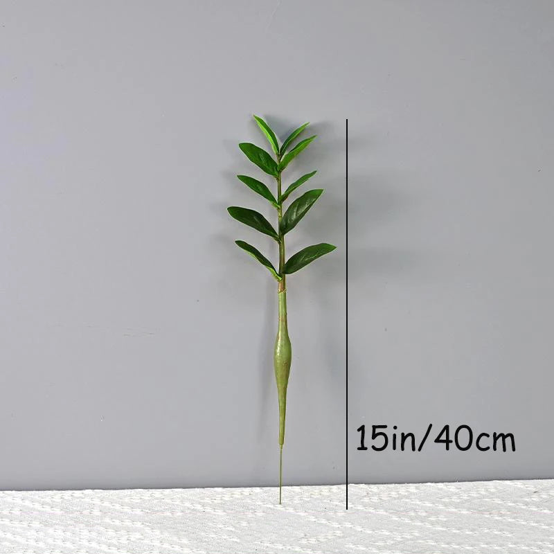 plantes artificielles branches vertes feuilles simples extérieur moderne pot blanc exposé