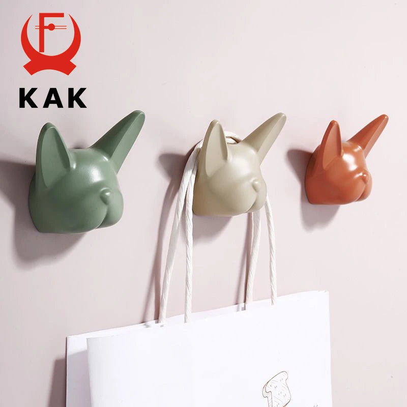 porte sacs tête chien vert beige orange noir résine brillante moderne
