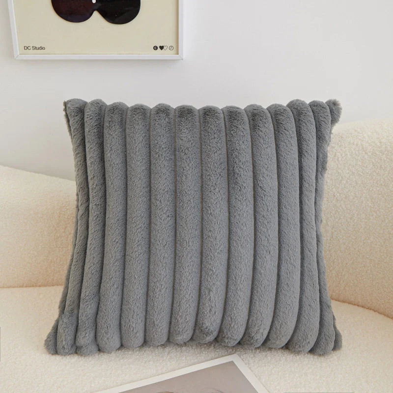 coussins rectangulaires peluche douce rose clair vert pastel lit tissé rayures horizontales moderne respectueux