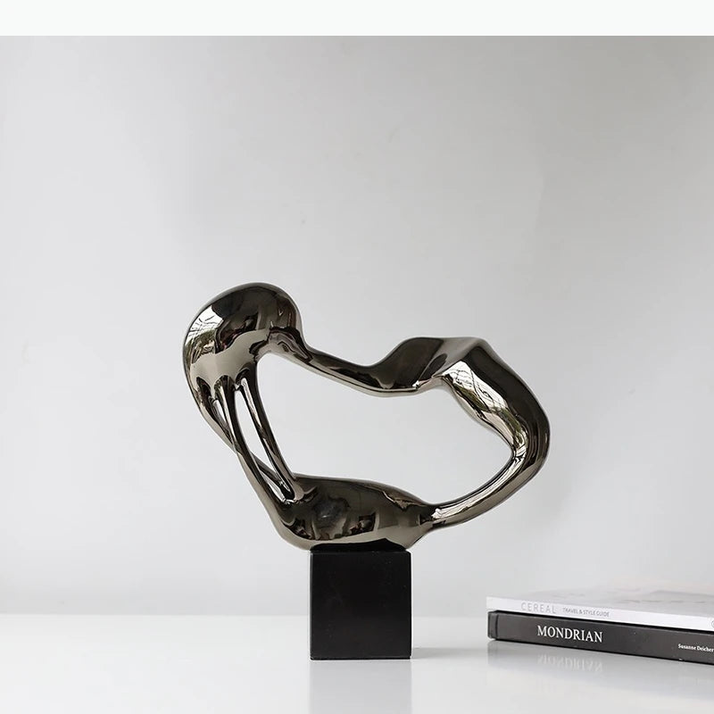 sculpture abstraite moderne argentée décoration intérieure minimaliste forme organique ornement