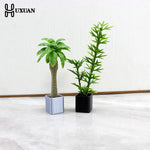 décoration intérieure plante artificielle fleurs feuilles pot terre cuite galets blancs moderne minimaliste