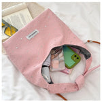 sac main femme rose clair étoiles dorées doux moderne casual tote toile