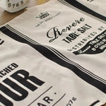 rideau vintage graphique étiquettes anciennes tissu granuleux crème noir suspension tringle métallique