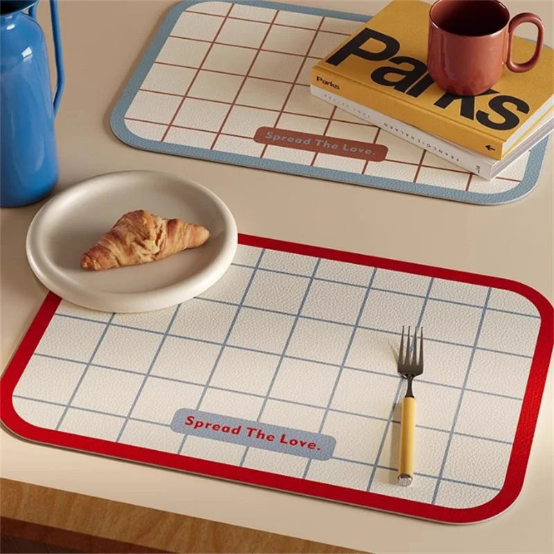 tapis table moderne rectangle blanc bleu vert rouge grille bordure colorée assiette cuillère tasse