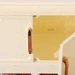 armoire pliante tiroirs beige moderne rayures diagonales poignées dorées roulettes sans
