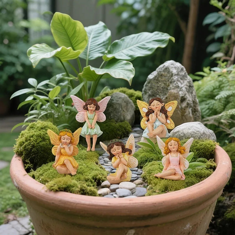 statues fées miniatures résine vert rose jaune robes colorées ailes translucides fantaisie decoration exterieure