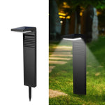 Lampe solaire sur pied avec éclairage blanc chaud dans une pelouse
