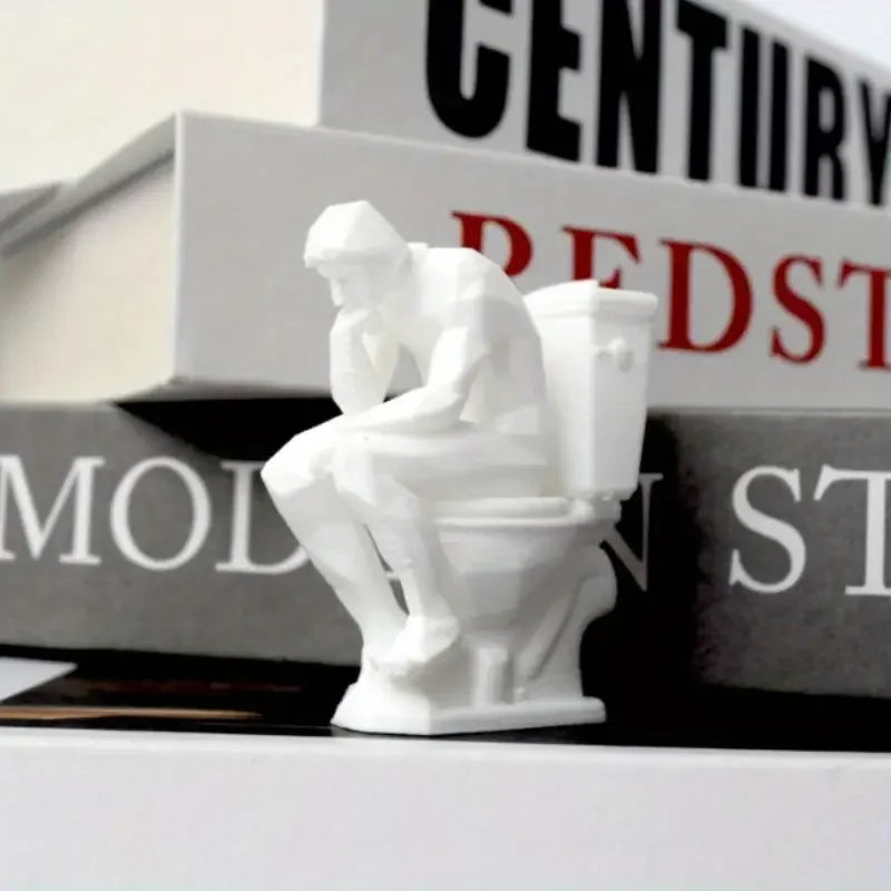 statue humoristique penseur assis toilettes blanc artistique parodie