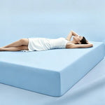 parure lit bleu clair drap housse élastique deux oreillers coton doux chambre moderne
