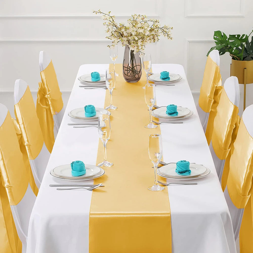 nappe satinée jaune doré blanc turquoise décoration table festive mariage événement spécial rubans décoratifs