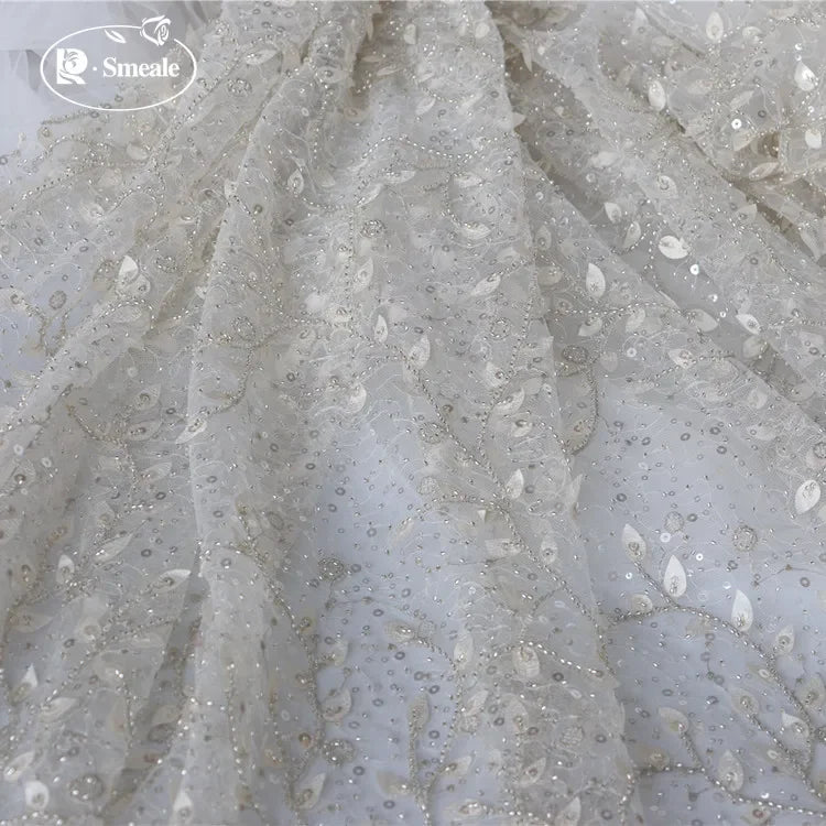 tissu dentelle feuilles brodé élégant polyester translucide blanc argent materiaux couture robes mariage
