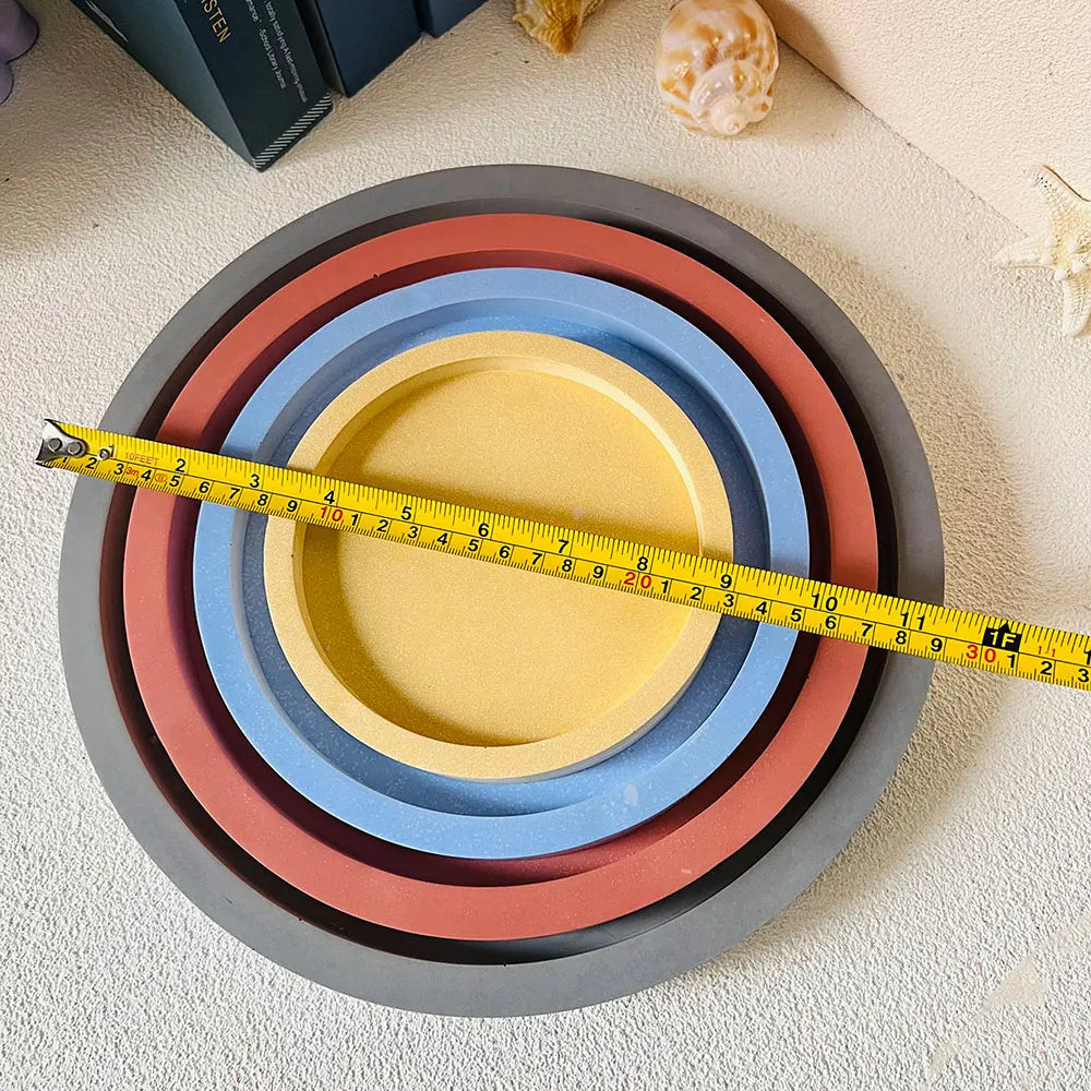 moulages silicone assiettes rondes modernes différentes tailles gris bleu rose jaune