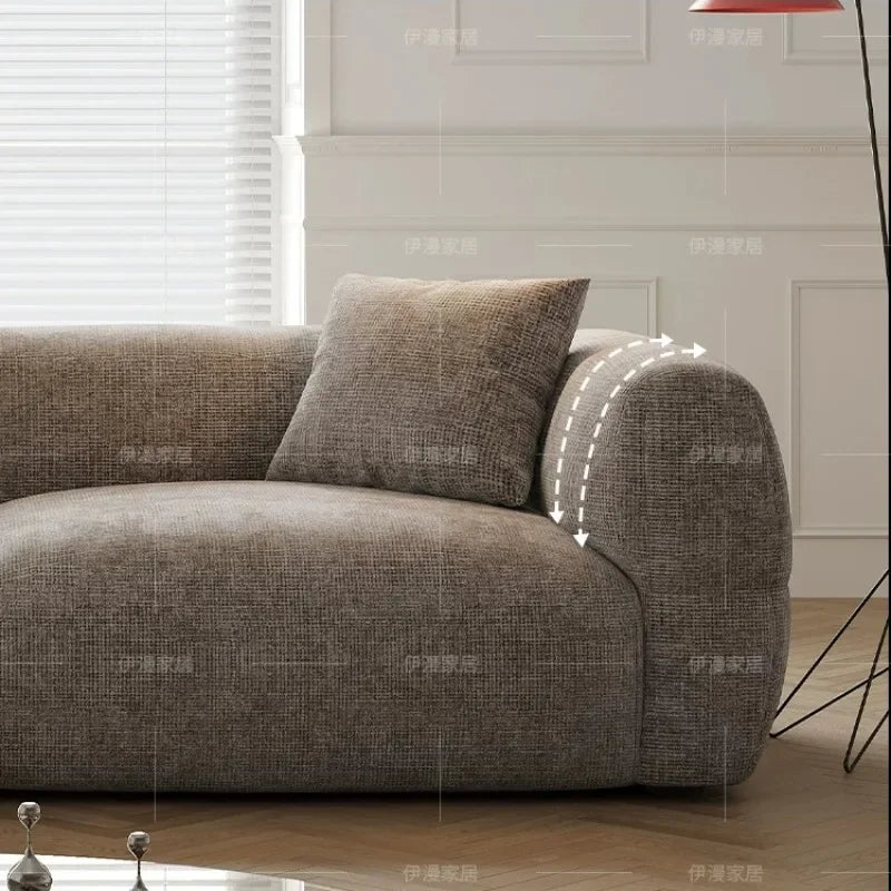canapé moderne gris tissu uni coussins petite grande pièce minimaliste