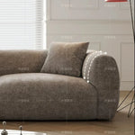 canapé moderne gris tissu uni coussins petite grande pièce minimaliste