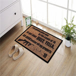 tapis porte antidérapant motif arme feu humoristique couleur marron noir gris blanc