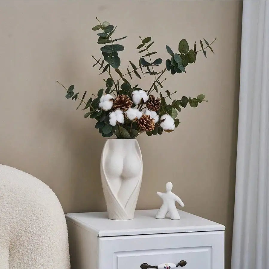 vases céramique modernes blancs fleurs séchées décoration table salon humains stylisés minimaliste