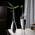 vase verre transparent minimaliste japonais fleurs branches feuilles