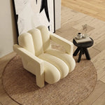 fauteuil moderne tissu texturé beige jaune marron clair coussin décoratif salon minimaliste