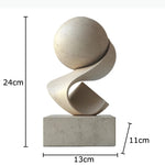 sculpture abstraite moderne minimaliste blanc doré beige gris foncé socle pierre marbre