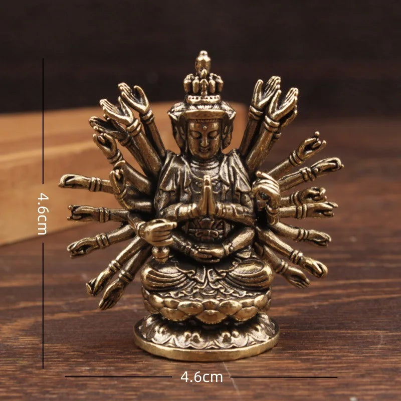 statue bouddhiste traditionnelle bronze doré détails sculptés surface lisse deux figures multiples bras