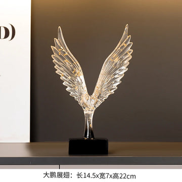 statuette animale moderne transparente dorée oiseau cerfs ailes déployées base noire